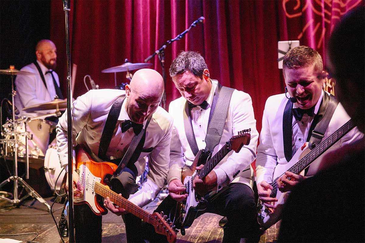 The Plush guitar and bass players performing